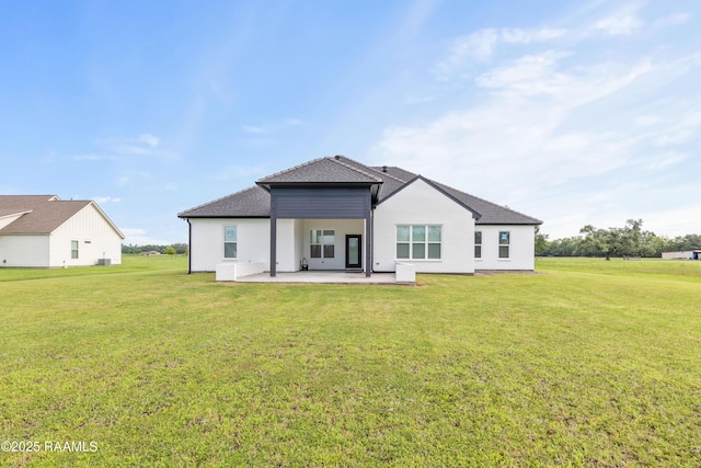 1114 Dermelie Calais Rd, Breaux Bridge, LA 70517 - rear view of property featuring a patio, a yard, and a shingled roof