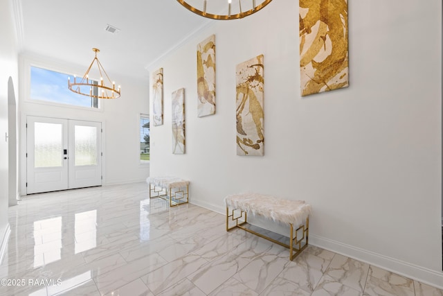 1114 Dermelie Calais Rd, Breaux Bridge, LA 70517 - foyer entrance featuring a chandelier, light marble finish floors, crown molding, and french doors