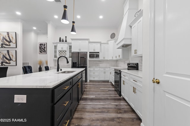 1114 Dermelie Calais Rd, Breaux Bridge, LA 70517 - kitchen featuring appliances with stainless steel finishes, white cabinetry, crown molding, a kitchen island with sink, and decorative light fixtures