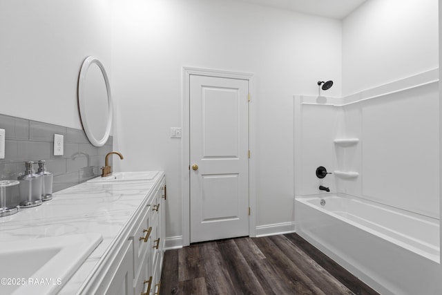 1114 Dermelie Calais Rd, Breaux Bridge, LA 70517 - bathroom with double vanity, wood finished floors, shower / bathtub combination, and tasteful backsplash