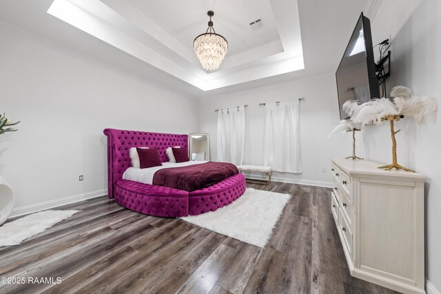 1114 Dermelie Calais Rd, Breaux Bridge, LA 70517 - bedroom featuring a tray ceiling, a chandelier, and dark wood-style floors