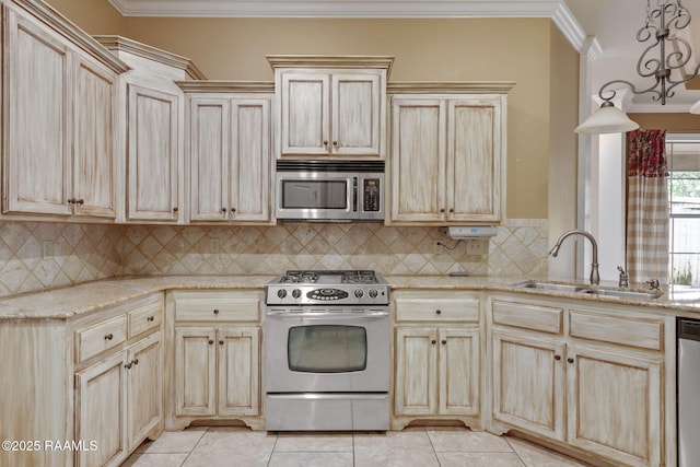 200 Croft Row, Lafayette, LA 70503 - kitchen with stainless steel appliances, light brown cabinets, light tile patterned floors, and ornamental molding