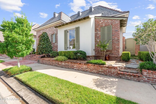 106 Brickell Way, Lafayette, LA 70508 - view of side of property featuring brick siding and a high end roof