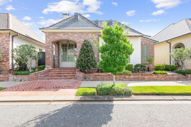 106 Brickell Way, Lafayette, LA 70508 - view of front of house with brick siding and a chimney