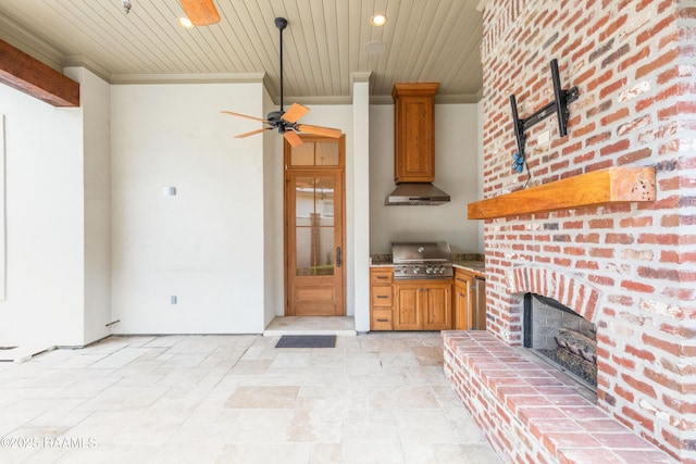 106 Brickell Way, Lafayette, LA 70508 - kitchen with ornamental molding, wall chimney exhaust hood, stone tile flooring, wood ceiling, and a brick fireplace