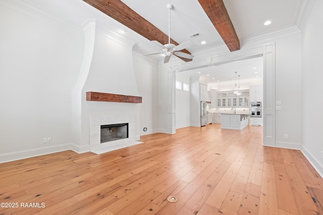 106 Brickell Way, Lafayette, LA 70508 - unfurnished living room with a ceiling fan, light wood-style flooring, beam ceiling, a fireplace, and ornamental molding