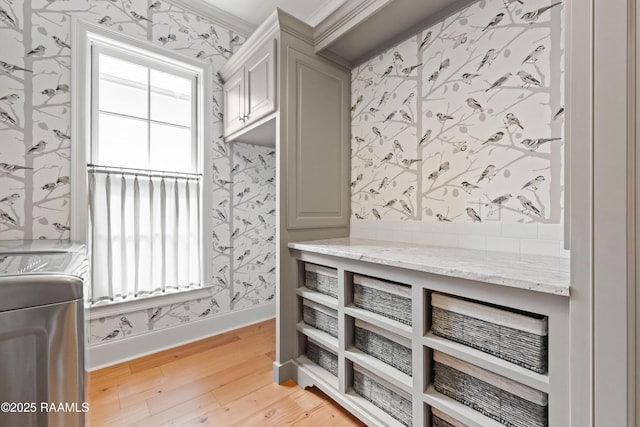 106 Brickell Way, Lafayette, LA 70508 - interior space with wallpapered walls, cabinet space, light wood-style floors, and crown molding