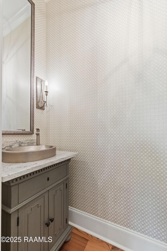 106 Brickell Way, Lafayette, LA 70508 - bathroom with vanity, wood finished floors, wallpapered walls, and crown molding