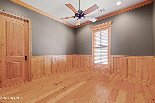 106 Brickell Way, Lafayette, LA 70508 - unfurnished room featuring a wainscoted wall, wood-type flooring, a ceiling fan, and crown molding