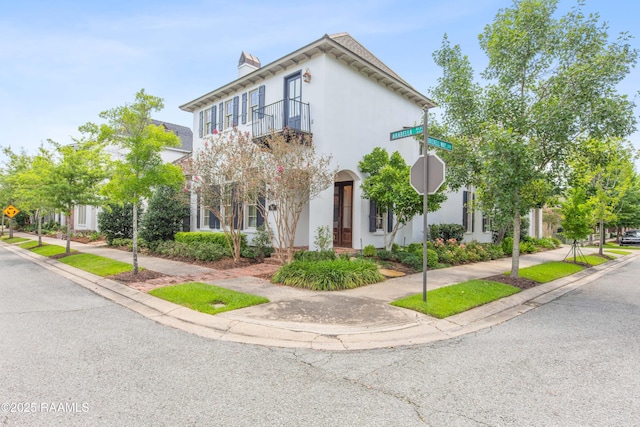 407 Arabella Blvd, Lafayette, LA 70508 - multi unit property with stucco siding, a balcony, and a chimney
