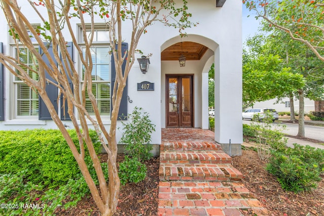 407 Arabella Blvd, Lafayette, LA 70508 - view of exterior entry featuring stucco siding and covered porch