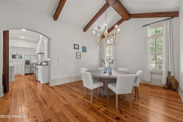407 Arabella Blvd, Lafayette, LA 70508 - dining space featuring arched walkways, light wood-style floors, and a chandelier