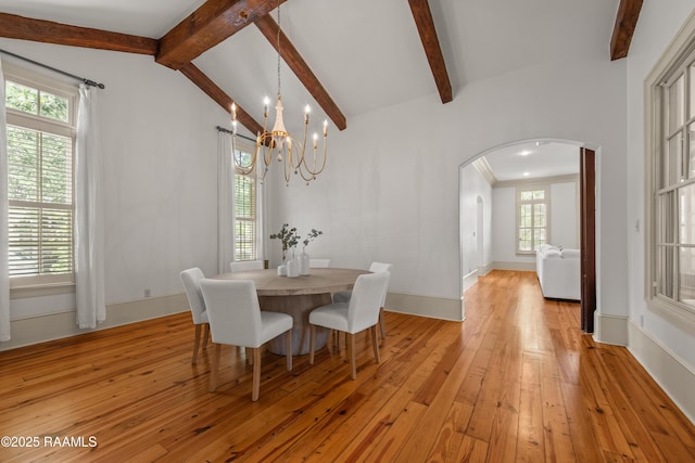 407 Arabella Blvd, Lafayette, LA 70508 - dining space featuring arched walkways, a chandelier, and light wood-style floors