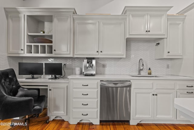 407 Arabella Blvd, Lafayette, LA 70508 - kitchen featuring dishwasher, light countertops, decorative backsplash, and white cabinetry