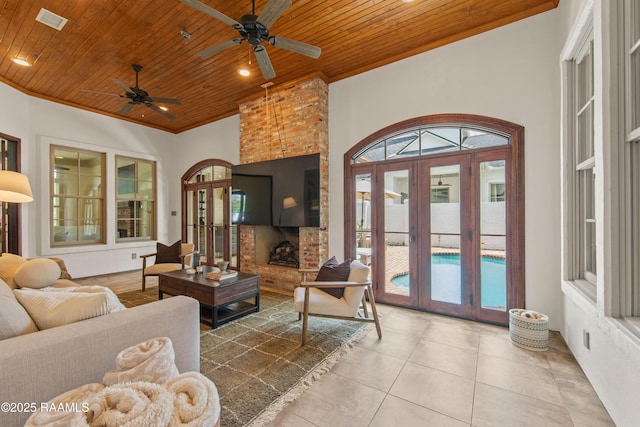 407 Arabella Blvd, Lafayette, LA 70508 - living room with wooden ceiling, french doors, tile patterned flooring, a ceiling fan, and ornamental molding