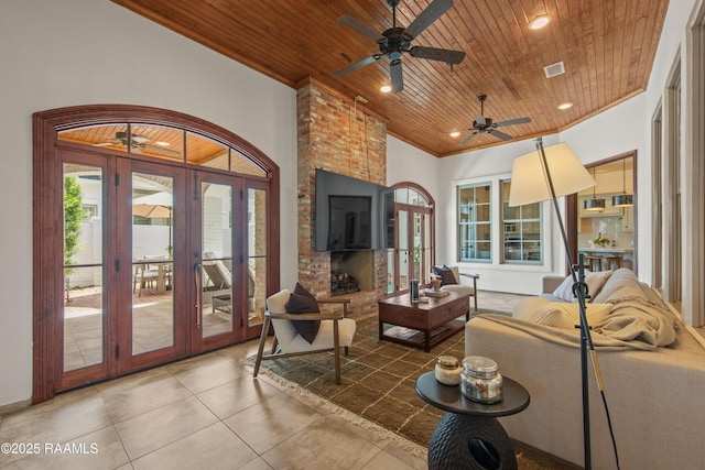 407 Arabella Blvd, Lafayette, LA 70508 - living area with wooden ceiling, french doors, ceiling fan, ornamental molding, and light tile patterned floors