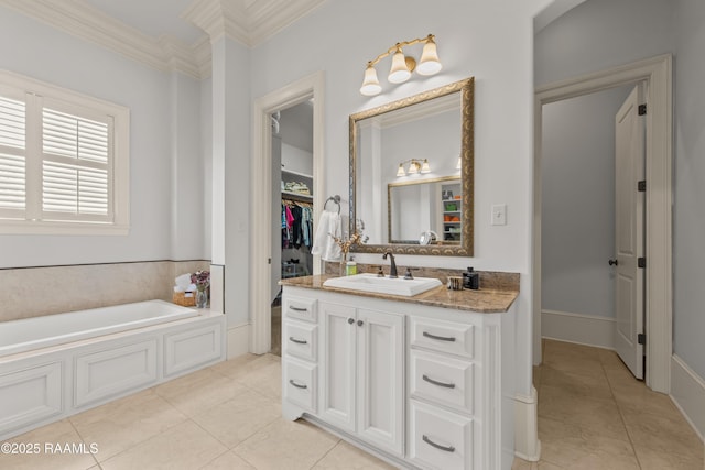 407 Arabella Blvd, Lafayette, LA 70508 - bathroom with tile patterned flooring, vanity, a garden tub, ornamental molding, and a walk in closet