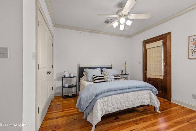 407 Arabella Blvd, Lafayette, LA 70508 - bedroom featuring crown molding, light wood-type flooring, a ceiling fan, and a closet