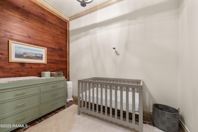 407 Arabella Blvd, Lafayette, LA 70508 - bedroom with wooden walls, crown molding, and a crib
