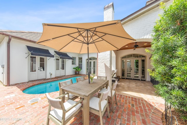 407 Arabella Blvd, Lafayette, LA 70508 - swimming pool featuring french doors, a patio, and outdoor dining area