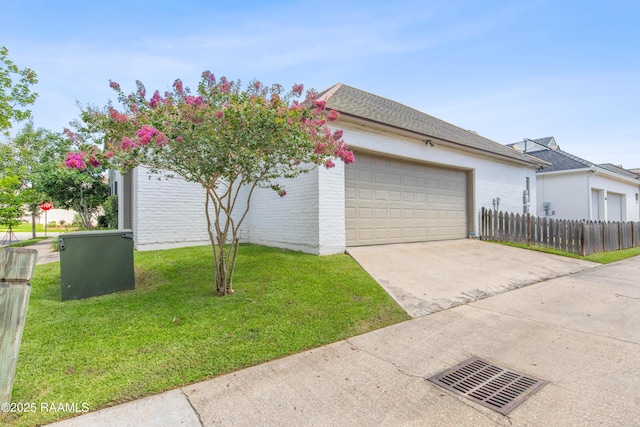 407 Arabella Blvd, Lafayette, LA 70508 - view of property exterior with an attached garage, driveway, and brick siding