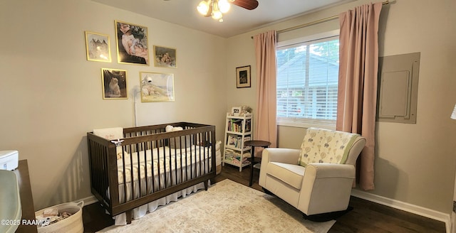 106 Paris St, Lafayette, LA 70506 - bedroom featuring a crib, wood finished floors, and electric panel