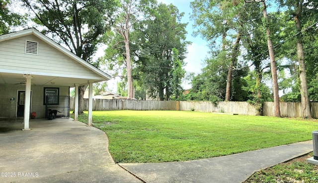 106 Paris St, Lafayette, LA 70506 - fenced backyard featuring a ceiling fan and a carport