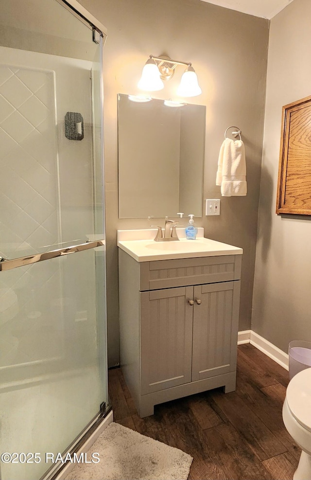 106 Paris St, Lafayette, LA 70506 - bathroom featuring a shower stall, wood finished floors, and vanity