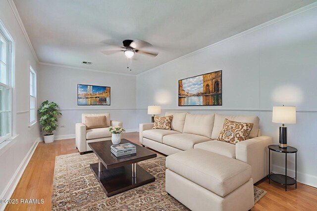 707 Compton St, New Iberia, LA 70560 - living area with light wood-type flooring, crown molding, and a ceiling fan