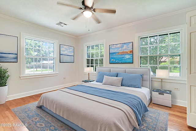 707 Compton St, New Iberia, LA 70560 - bedroom with crown molding, wood finished floors, and a ceiling fan