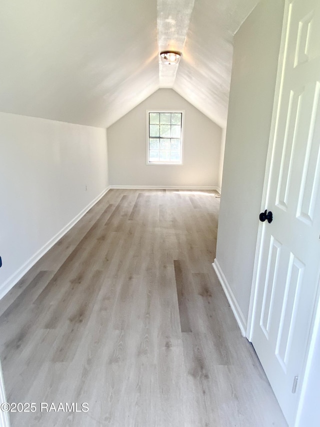 707 Compton St, New Iberia, LA 70560 - additional living space featuring lofted ceiling and wood finished floors