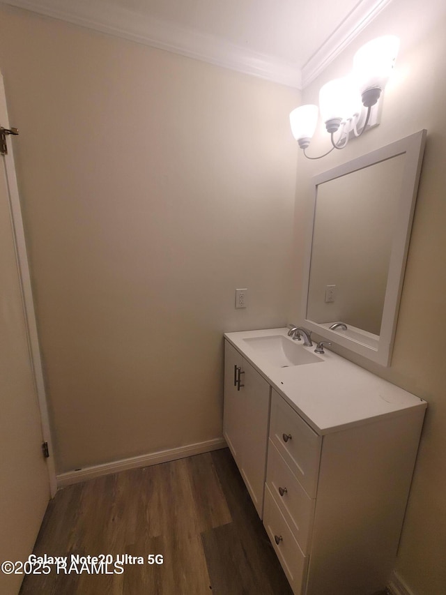 117 Luna St, Lafayette, LA 70506 - bathroom featuring crown molding, wood finished floors, a chandelier, and vanity