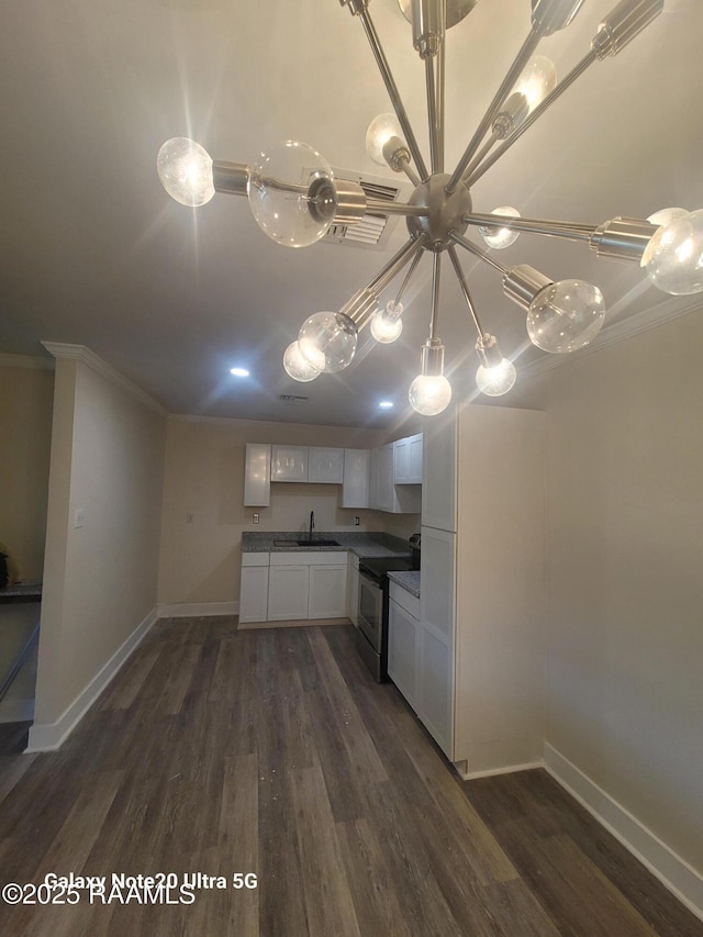 117 Luna St, Lafayette, LA 70506 - kitchen featuring stainless steel range with electric stovetop, crown molding, white cabinetry, dark wood-style floors, and hanging light fixtures