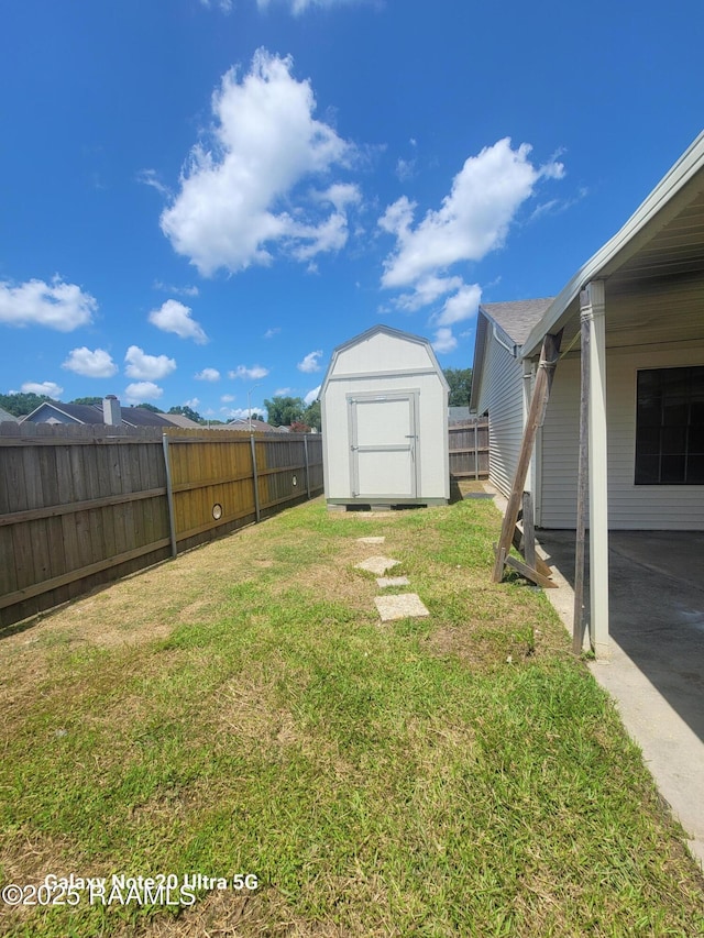 117 Luna St, Lafayette, LA 70506 - fenced backyard with a storage unit and a patio area