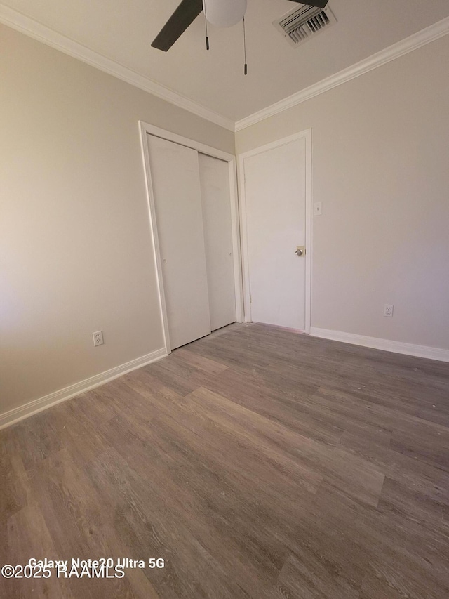 117 Luna St, Lafayette, LA 70506 - unfurnished bedroom featuring wood finished floors, a closet, crown molding, and a ceiling fan