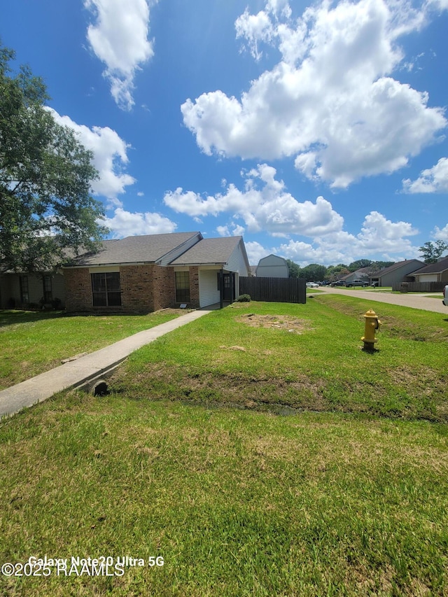 117 Luna St, Lafayette, LA 70506 - single story home featuring an attached garage, driveway, and brick siding