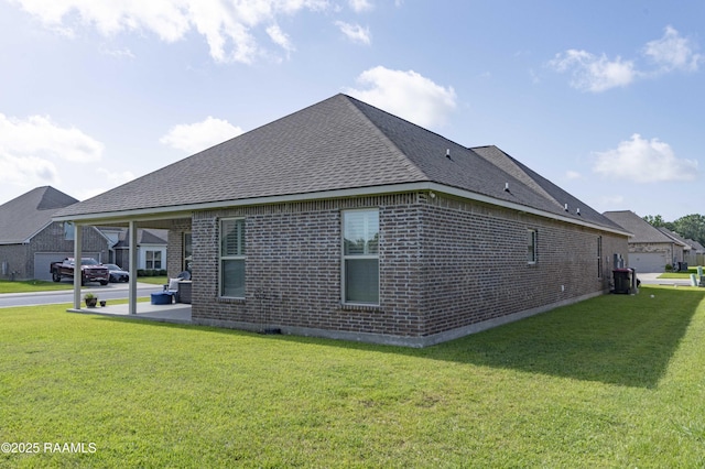 100 Rose Of Sharon Ln, Lafayette, LA 70508 - view of property exterior featuring brick siding, a shingled roof, a lawn, and a patio area