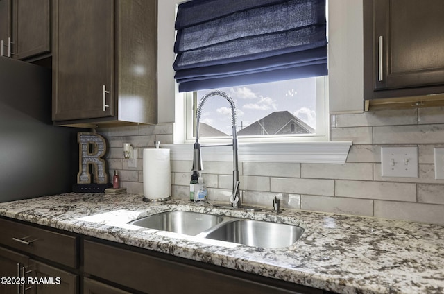 100 Rose Of Sharon Ln, Lafayette, LA 70508 - kitchen with dark brown cabinets, backsplash, and light stone counters