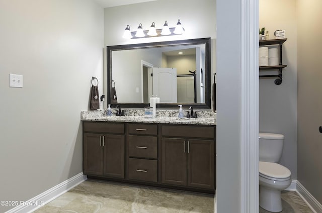 100 Rose Of Sharon Ln, Lafayette, LA 70508 - bathroom featuring double vanity and baseboards