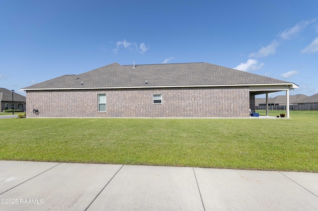 100 Rose Of Sharon Ln, Lafayette, LA 70508 - view of property exterior featuring a yard, brick siding, and roof with shingles