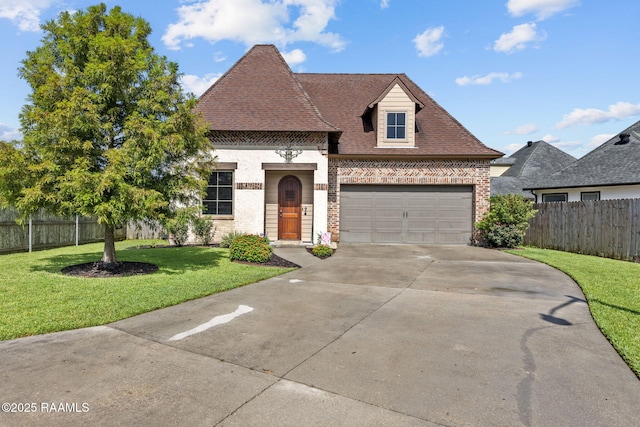 103 Majestic Oaks Dr, Broussard, LA 70518 - french country home with brick siding, driveway, and an attached garage