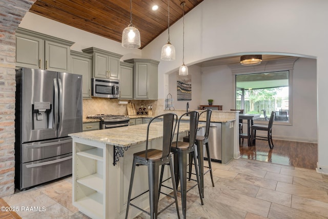 103 Majestic Oaks Dr, Broussard, LA 70518 - kitchen with appliances with stainless steel finishes, gray cabinetry, wood ceiling, light stone counters, and open shelves