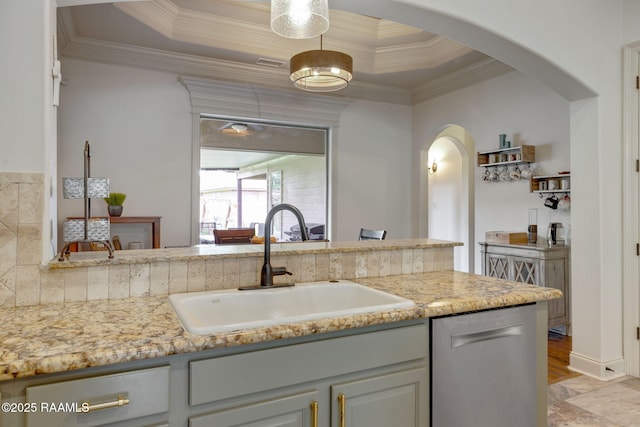 103 Majestic Oaks Dr, Broussard, LA 70518 - kitchen with arched walkways, dishwasher, a tray ceiling, ornamental molding, and light stone counters