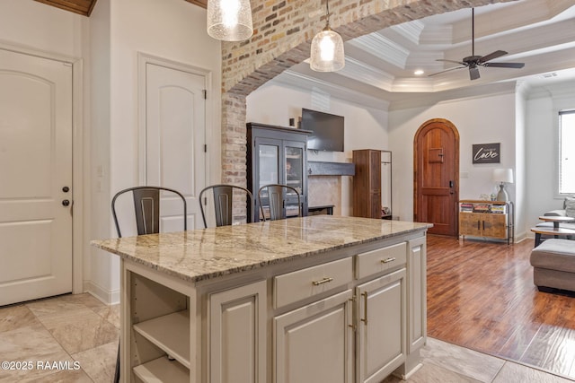 103 Majestic Oaks Dr, Broussard, LA 70518 - kitchen featuring ornamental molding, open shelves, light stone counters, open floor plan, and ceiling fan
