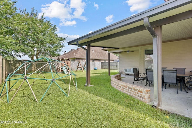 103 Majestic Oaks Dr, Broussard, LA 70518 - fenced backyard featuring a patio, ceiling fan, and a playground