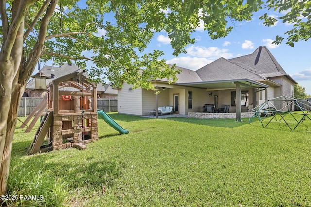 103 Majestic Oaks Dr, Broussard, LA 70518 - rear view of property with a playground, roof with shingles, a fenced backyard, and a patio