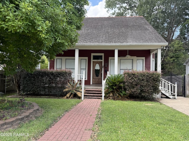 121 N 9th St, Eunice, LA 70535 - view of front of home with a porch and a shingled roof
