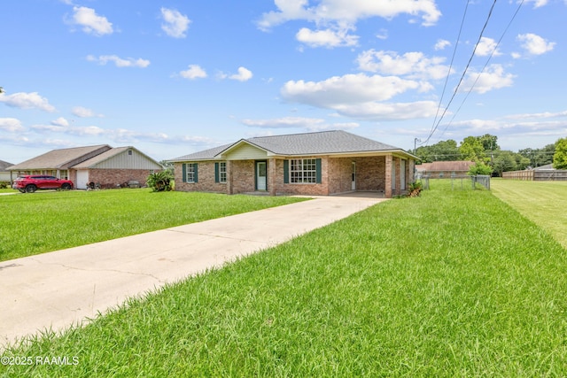 189 Jeremy Rd, Opelousas, LA 70570 - ranch-style house with concrete driveway, a carport, brick siding, and roof with shingles
