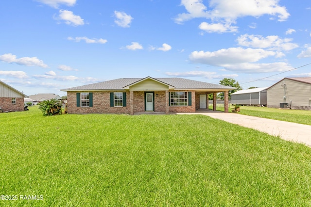 189 Jeremy Rd, Opelousas, LA 70570 - ranch-style house featuring driveway, a carport, a front yard, roof with shingles, and brick siding