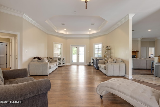 742 Hummingbird Ln, New Iberia, LA 70563 - living room with a raised ceiling, wood finished floors, ornamental molding, and recessed lighting